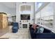 Bright living room with fireplace, large TV, and comfortable seating at 632 Pinewood Dr, Davenport, FL 33896
