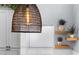 Modern kitchen with gray cabinets and a stylish light fixture at 632 Pinewood Dr, Davenport, FL 33896