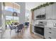 Modern kitchen with gray cabinets and view of backyard patio at 632 Pinewood Dr, Davenport, FL 33896