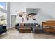 Living room with sectional sofa, coffee table, and large windows at 632 Pinewood Dr, Davenport, FL 33896
