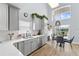 Modern kitchen with gray cabinets and view of backyard patio at 632 Pinewood Dr, Davenport, FL 33896
