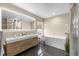 Modern bathroom with a double vanity, soaking tub, and walk-in shower at 632 Pinewood Dr, Davenport, FL 33896