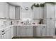 Modern kitchen with gray cabinets and white quartz countertops at 632 Pinewood Dr, Davenport, FL 33896