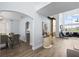 Open concept dining area with modern light fixtures and hardwood floors at 632 Pinewood Dr, Davenport, FL 33896