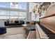 Living room with a grand piano and a large world map on the wall at 632 Pinewood Dr, Davenport, FL 33896