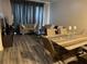 Living room with wood floors and ample seating at 6364 Sedgeford Dr, Lakeland, FL 33811
