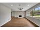 Open concept living room with hardwood floors, fireplace and large windows at 905 Valencia Rd, South Daytona, FL 32119