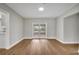Spacious dining room with hardwood floors and French doors leading to backyard at 905 Valencia Rd, South Daytona, FL 32119