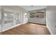 Sunroom with hardwood floors, French doors and large windows at 905 Valencia Rd, South Daytona, FL 32119