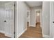 Hallway with hardwood floors and access to bathroom and bedroom at 905 Valencia Rd, South Daytona, FL 32119