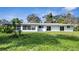 Newly renovated light blue house with a large grassy backyard at 905 Valencia Rd, South Daytona, FL 32119