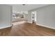 Bright living room with hardwood floors and view into kitchen at 905 Valencia Rd, South Daytona, FL 32119