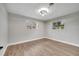 Well-lit bedroom with hardwood floors and multiple windows at 905 Valencia Rd, South Daytona, FL 32119