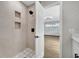 Updated bathroom with a walk-in shower and patterned floor tiles at 905 Valencia Rd, South Daytona, FL 32119