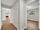 Hallway with hardwood floors and access to bedrooms and closets at 905 Valencia Rd, South Daytona, FL 32119