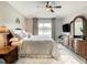 Main bedroom with king-size bed, a large TV and ensuite bathroom access at 973 Lake Berkley Dr, Kissimmee, FL 34746