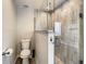 Clean bathroom featuring a toilet, shower, and granite vanity at 973 Lake Berkley Dr, Kissimmee, FL 34746
