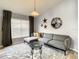 Living room with gray sectional sofa and coffee table at 973 Lake Berkley Dr, Kissimmee, FL 34746