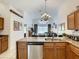 Modern kitchen featuring granite countertops and stainless steel appliances at 973 Lake Berkley Dr, Kissimmee, FL 34746