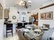 Well-equipped kitchen with granite countertops and breakfast bar, adjacent to the dining area at 973 Lake Berkley Dr, Kissimmee, FL 34746