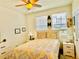 Bedroom with a double bed, ceiling fan, and two nightstands at 1608 Cross Prairie Pkwy, Kissimmee, FL 34744