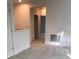 Luminous hallway with carpeted floors and doors to other rooms at 6560 Candied Peel Aly, Winter Garden, FL 34787