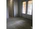 Bright bedroom with carpet flooring, double doors to patio, and an ensuite bathroom at 6560 Candied Peel Aly, Winter Garden, FL 34787