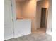 Bright hallway with carpeted floors and doors to bedrooms at 6560 Candied Peel Aly, Winter Garden, FL 34787