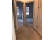 Hallway with two bedrooms and carpeted flooring at 6560 Candied Peel Aly, Winter Garden, FL 34787