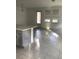 Open concept kitchen with island and tile floors at 6560 Candied Peel Aly, Winter Garden, FL 34787