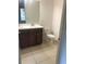 Clean bathroom with double vanity, tile flooring, and a toilet at 6560 Candied Peel Aly, Winter Garden, FL 34787