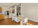 Bright dining room with wood flooring and seating for six at 9016 Murano Mews Ct, Kissimmee, FL 34747