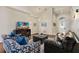 Spacious living room featuring two couches and a large TV at 9016 Murano Mews Ct, Kissimmee, FL 34747