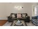 Comfortable living room with a leather couch and modern decor at 9016 Murano Mews Ct, Kissimmee, FL 34747