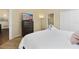 Spacious bedroom with a dresser, king-size bed and en-suite bathroom at 9016 Murano Mews Ct, Kissimmee, FL 34747