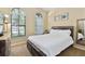 Spacious bedroom with a platform bed and large windows at 9016 Murano Mews Ct, Kissimmee, FL 34747