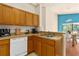 Well-equipped kitchen featuring wood cabinets and modern appliances at 9016 Murano Mews Ct, Kissimmee, FL 34747