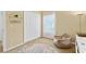 Relaxing bedroom with a beanbag chair, closet, and a circular rug at 9016 Murano Mews Ct, Kissimmee, FL 34747