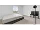 Simple bedroom with a mattress and two black chairs at 14442 Noto Ave, Clermont, FL 34714