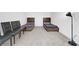 Bedroom with two twin beds and four chairs at 14442 Noto Ave, Clermont, FL 34714