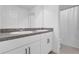 Modern bathroom with double vanity and shower/tub combo at 14442 Noto Ave, Clermont, FL 34714