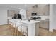 Modern kitchen with white quartz countertops and taupe cabinets at 14442 Noto Ave, Clermont, FL 34714