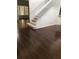 Spacious living room with hardwood floors and staircase at 255 Abbotsbury Dr, Kissimmee, FL 34758