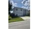 Two-story house with attached garage and front yard at 255 Abbotsbury Dr, Kissimmee, FL 34758