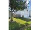 Side view of two-story house with attached garage at 255 Abbotsbury Dr, Kissimmee, FL 34758