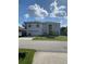 Two-story house with attached garage and front yard at 255 Abbotsbury Dr, Kissimmee, FL 34758