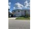 Two-story house with attached garage and front yard at 255 Abbotsbury Dr, Kissimmee, FL 34758