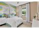 Bright bedroom with geometric accent wall and comfortable bed at 4060 Bannock Ave, Tavares, FL 32778