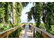 Wooden boardwalk path leads to a scenic lake view at 4060 Bannock Ave, Tavares, FL 32778