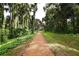 Peaceful nature trail lined with lush greenery at 4072 Bannock Ave, Tavares, FL 32778